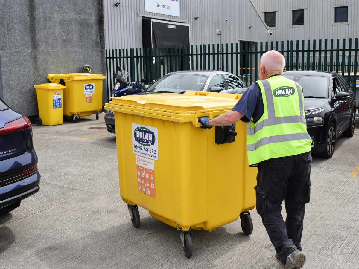 Nolan Recycling Ltd 1100L Commercial Wheelie Bin being delivered to a local business to aid with Waste Management