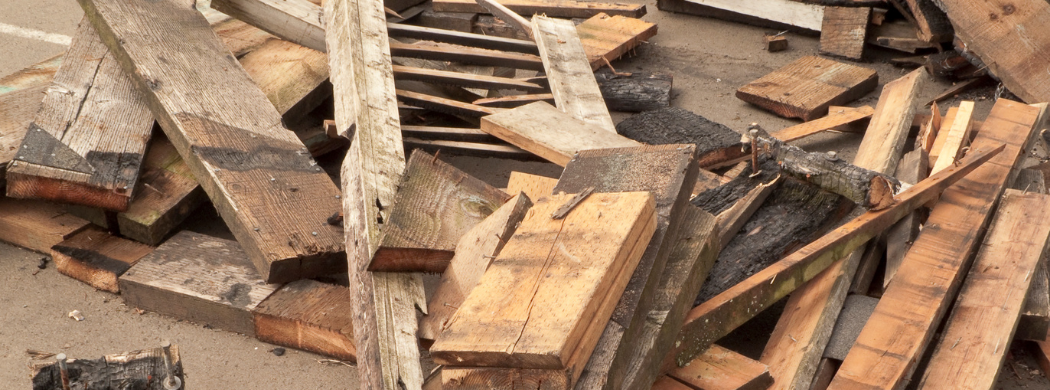Image of various lengths of wood awaiting recycling.